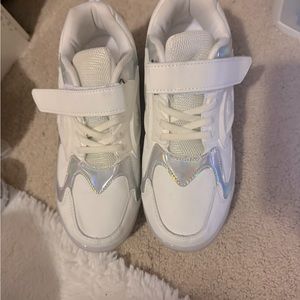 White shoes with wheels on the bottom. Woman’s size 6. Shoes With Velcro.